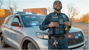 Officer Mohamed Magassouba standing in front of his Capitol Heights Police Department cruiser.