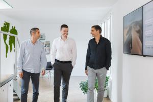 Managing Partners Fady El-Murr (left) and Jens Schmitz (right) welcome Johannes Burk (middle) as Head of Global Business Development in the company's headquarters