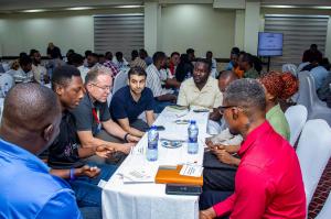 A group of people having a discussion at a networking event.