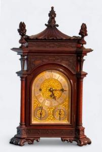 Tiffany & Co. finely carved rosewood Chippendale style musical library clock, surmounted by a pagoda-form top with carved finials and foliate detail, on paw feet. Estimate: $10,000-$25,000.