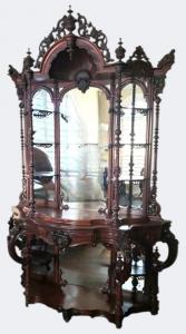 Victorian Rococo Revival étagère (or display cabinet) in laminated rosewood, boldly stamped on the reverse, “From T. Brooks Cabinet & Upholstery Warehouse”. Estimate: $4,000-$25,000.