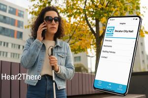BVI lady with cane and using the H2T app