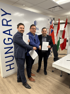 Leaders from UPHOME and HEPA Canada celebrate the signing of a strategic partnership agreement.