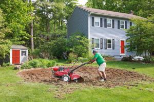 Mike The Seed Man uses a tiller to break up turf, demonstrating a fast, effective way to prepare soil for wildflowers and support the Reduce Your Lawn movement.