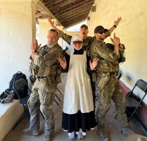Sister Karina posed with three military men