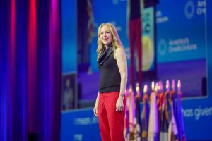 Stacey Hanke, Executive Presence Expert and Thought Leader, addresses a group of listeners at America's Credit Union annual conference.