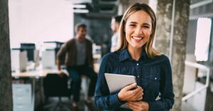 Smiling woman who is a coworking community manager