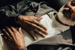 A person rests with hands on their chest, wearing an Oura Ring used to monitor sleep, stress, and wellness as part of Connect Family Law’s holistic client program.