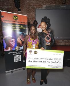 Keisha Charmaine and Lovaeta with her Locsanity Community Impact Award and check