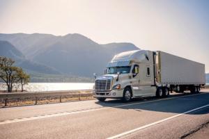 "An 18-wheeler transporting freight, representing the trucking and logistics industry."