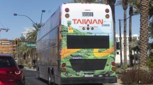 Taiwan Tourism bus advertisement featuring the misty Alishan tea terraces.