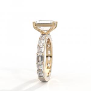 The Jewelers Coin & Loan Co. side perspective view crafting a 4ct emerald-cut diamond ring in 18k yellow gold with petite claw prongs