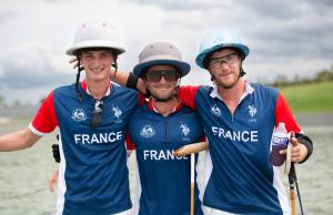 two arena polo players vie for the ball