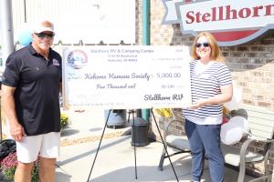 Doug Stellhorn, owner of Stellhorn RV & Camping Center in Kokomo, Indiana, presents a $5,000 donation to the Kokomo Humane Society during the dealership’s Dog Days of Summer community event.