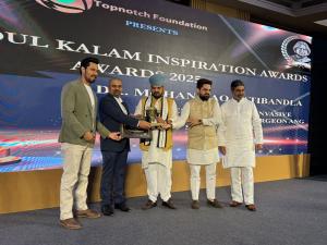 Dr. Mohana Rao Patibandla receiving the Best Minimally Invasive Neurosurgeon, Spine Surgeon, and Stereotactic Neurosurgeon award at the Abdul Kalam Inspiration Awards 2025 in New Delhi, presented in the presence of dignitaries including Brij Bhushan and a