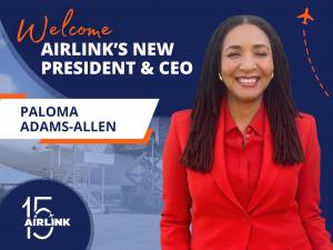 Woman in red stands smiling, with text "welcome Airlink's new CEO, Paloma Adams-Allen"