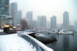 Downtown Vancouver during a snowfall demonstrating the need for reliable snow removal, plowing and winter road salting services