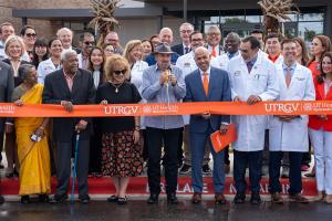 UTRGV President Guy Bailey cuts the ceremonial ribbon on Wednesday, Oct. 8, to officially open the UT Health RGV Cancer and Surgery Center in McAllen. (UTRGV Photo by Heriberto Perez Zuniga)