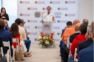 Dr. Everardo Cobos, interim dean of the UTRGV School of Medicine, speaks at a podium during the grand opening of the UT Health RGV Cancer and Surgery Center.