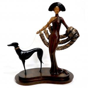 Bronze sculpture “Elegance” (Symphony in Black) by Erté featuring a woman and a greyhound in Art Deco style.