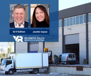 Ed O'Sullivan and Jennifer Gaynor of VR Business Sales Bucks County, specialists in business sales, mergers, and acquisitions, pictured above a warehouse and delivery trucks representing the recent sale of a regional electrical supply distribution company
