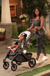 Ashli Auguillard pushes a baby stroller in a recurring role on the CBS sitcom THE NEIGHBORHOOD (photo courtesy CBS)