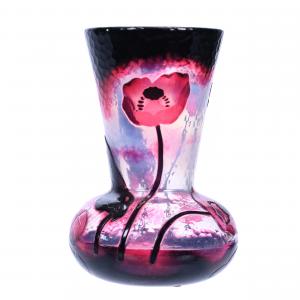 Signed Daum Nancy French cameo art glass vase, fire polished and of excellent quality. The 6 ¾ inch tall vase boasts a white translucent and dark cranberry ground. Estimate: $3,000-$5,000.