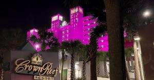 Resort with pink lights on it.