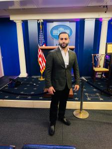 Dr. Amin Halum inside the White House Press Room, highlighting his presence and influence in U.S. policy, diplomacy, and Arab-American leadership.