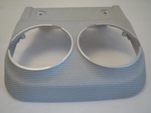 A beautifully textured metal car drinks holder