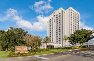 Exterior view of Renaissance Orlando Resort & Spa at Disney Springs®, an Official Walt Disney World® Hotel featuring modern architecture and inviting resort ambiance.