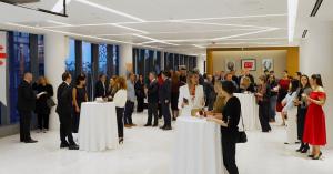 NYTS 2025 attendees group photo in New York event hall.