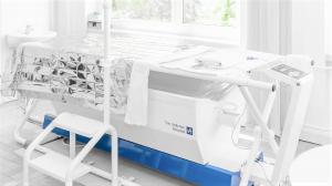 IRATHERM 1000M hardware showing integrated IRAcom monitoring system and water-filtered infrared-A radiator components
