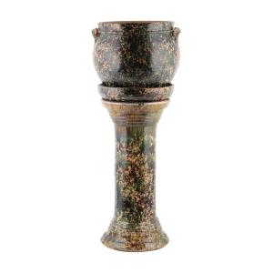 Jacobi Pottery of Waterloo County, Ontario three-piece plant stand, nearly 30 inches tall, having a spectacular glaze with heavy green and brown mottling over a peach color base (CA$8,260).