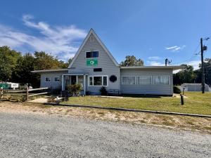 "Hidden Acres Family Campground": 34± acres, office, cabins, bath houses, pool, pond & Rt. 301 frontage in Caroline County, VA . 590'± of frontage on Rt. 301 •	The campground property has a main office building (4,098± sf. vinyl sided) which features 2 bathrooms,