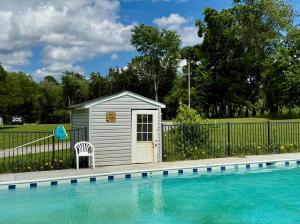 "Hidden Acres Family Campground": 34± acres, office, cabins, bath houses, pool, pond & Rt. 301 frontage in Caroline County, VA . 590'± of frontage on Rt. 301 •	The campground property has a main office building (4,098± sf. vinyl sided) which features 2 bathrooms,