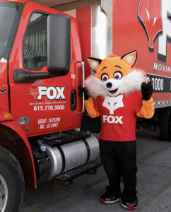 Movers of Fox Moving and Storage moving a truck