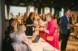 Shane and Rachel Krider chatting with Prosperity Of Life attendees during a break, reflecting the company’s focus on mentorship, connection, and personal growth.