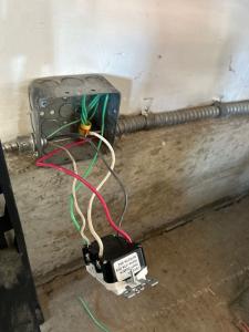 Melby Electric wiring installation in a residential space with a control box and wires