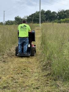Steven from Jefferson Land Clearing and Excavation trenching for utility lines for site preparation project