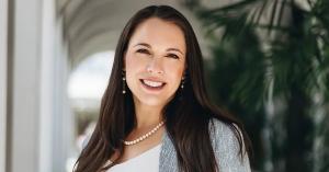 Nicole Martell, healthcare law attorney at Di Pietro Partners, smiling and wearing a suit