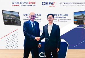 The picture is showing Mr. Xie Bing, CEO and President of Xiamen Airlines and Dominique Mineo, CEO and Founder of CEFA Aviation shaking hands in front of CEFA Aviation stand.