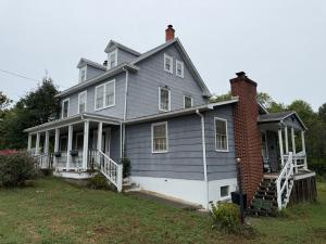 The home measures 2,372 +/- gross sf. (1,956 +/- sf. of living space & 416 +/- sf. basement) and has one bathroom on the main level, 3 bedrooms & one bathroom on the 2nd level, and 2 bedrooms on third level.  It features an short walk to Main Street