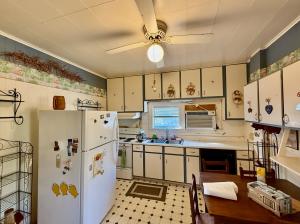 The home measures 2,372 +/- gross sf. (1,956 +/- sf. of living space & 416 +/- sf. basement) and has one bathroom on the main level, 3 bedrooms & one bathroom on the 2nd level, and 2 bedrooms on third level.  It features an short walk to Main Street