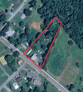 The home measures 2,372 +/- gross sf. (1,956 +/- sf. of living space & 416 +/- sf. basement) and has one bathroom on the main level, 3 bedrooms & one bathroom on the 2nd level, and 2 bedrooms on third level.  It features an short walk to Main Street