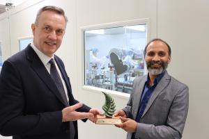 Grant Washington-Smith of Carefore Global congratulates Jignesh Patel on winning the award
