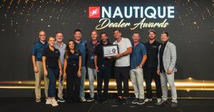 Wake United Surf + Wake Series accepts award for 2025 Nautique Dealer Event of the Year.