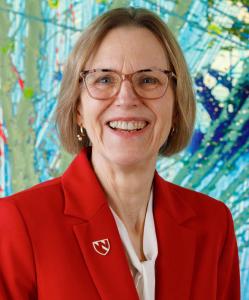 Photo of Joanne Sweasy in the Chihuly Sanctuary at the Fred & Pamela Buffett Cancer Center
