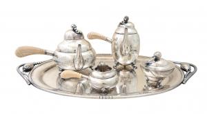 Five-piece George Jensen style La Paglia sterling silver tea and coffee service in the Blossom pattern. Estimate: $5,000-$10,000