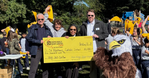 St Matthew's Catholic School celebrates $10,000 Vote for a School contest victory with Cooper Hurley Injury Lawyers partners and Eddy Eagle mascot